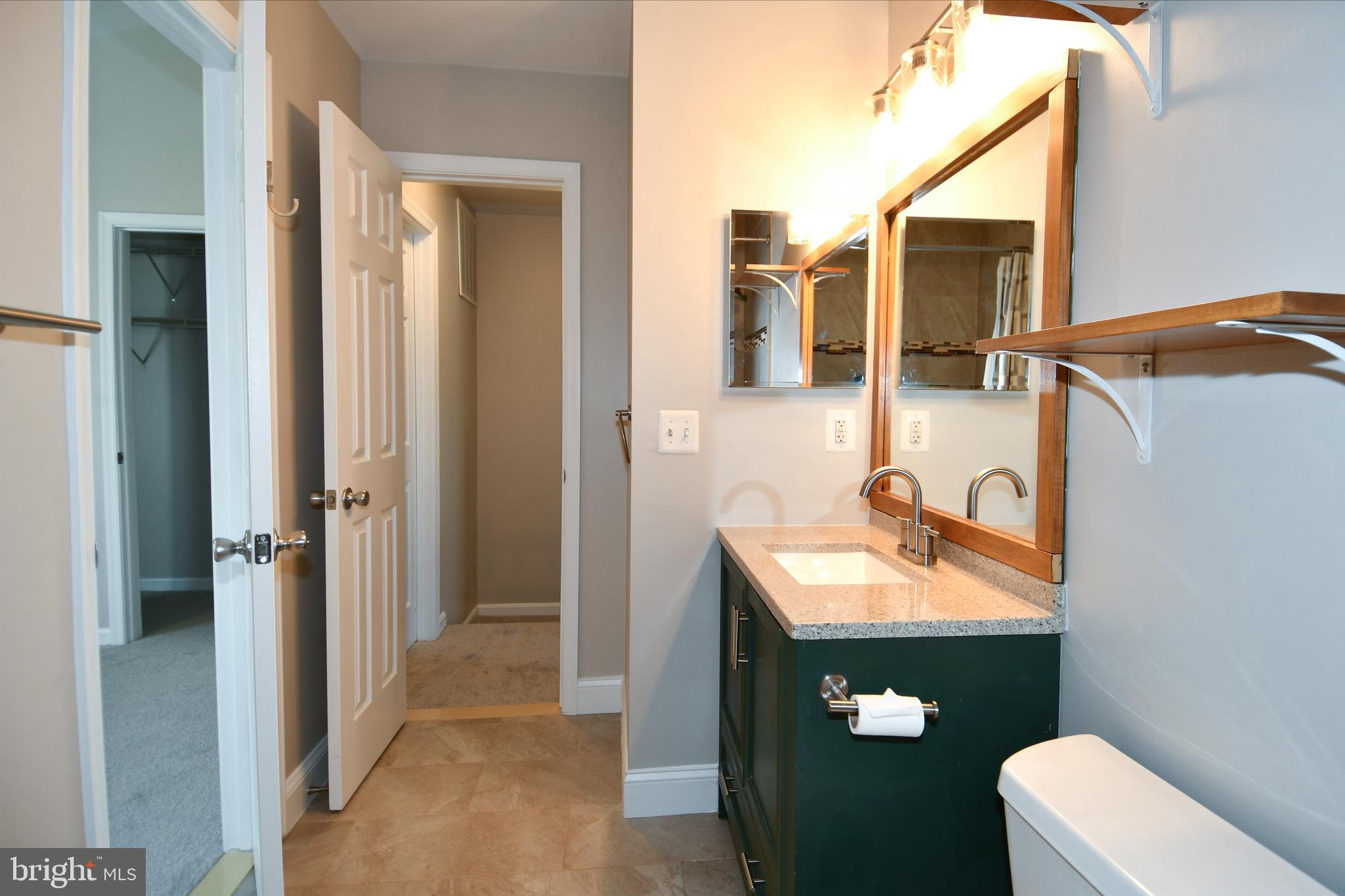 53 Essex Square Sterling, VA 20164 - Photo 10 of 25 a bathroom with a sink and a mirror
