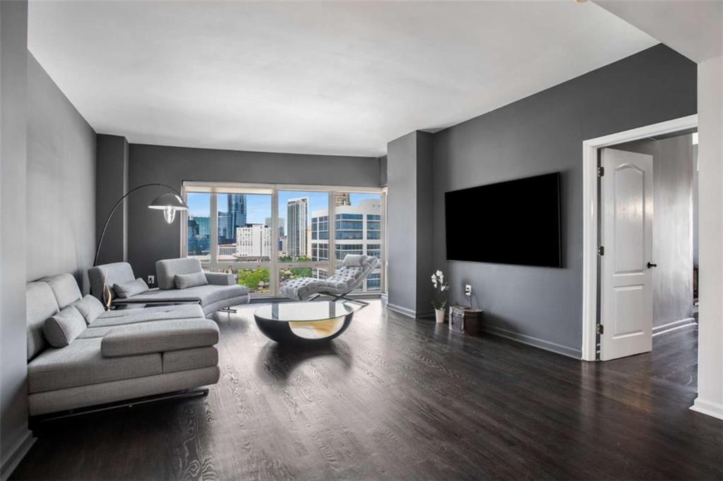 3475 Oak Valley Road Northeast, Unit 1630 Atlanta, GA 30326 - Photo 36 of 38 a living room with furniture and a flat screen tv