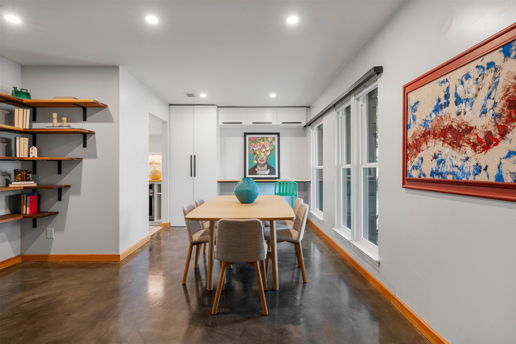 1111 Radam Circle Austin, TX 78745 - Photo 15 of 40 Built-in cabinetry lines one wall of the dining room, providing storage for serving pieces, glassware, or books while adding a custom feature that makes the space feel intentional rather than ordinary