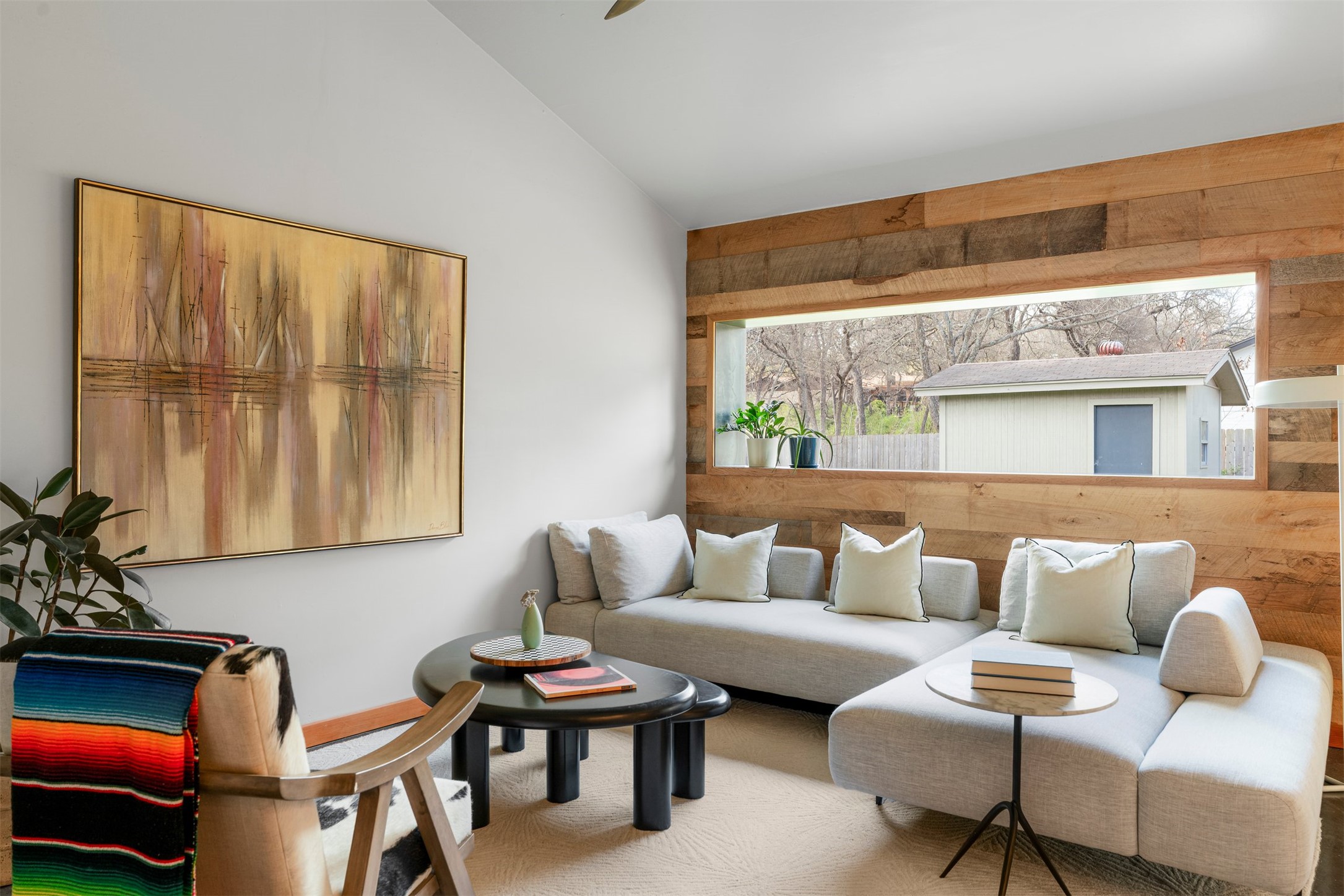 1111 Radam Circle Austin, TX 78745 - Photo 18 of 40 Natural light pours through the oversized picture window, giving the living room a bright, open feel and creating a comfortable place to gather, relax, or enjoy quiet evenings at home