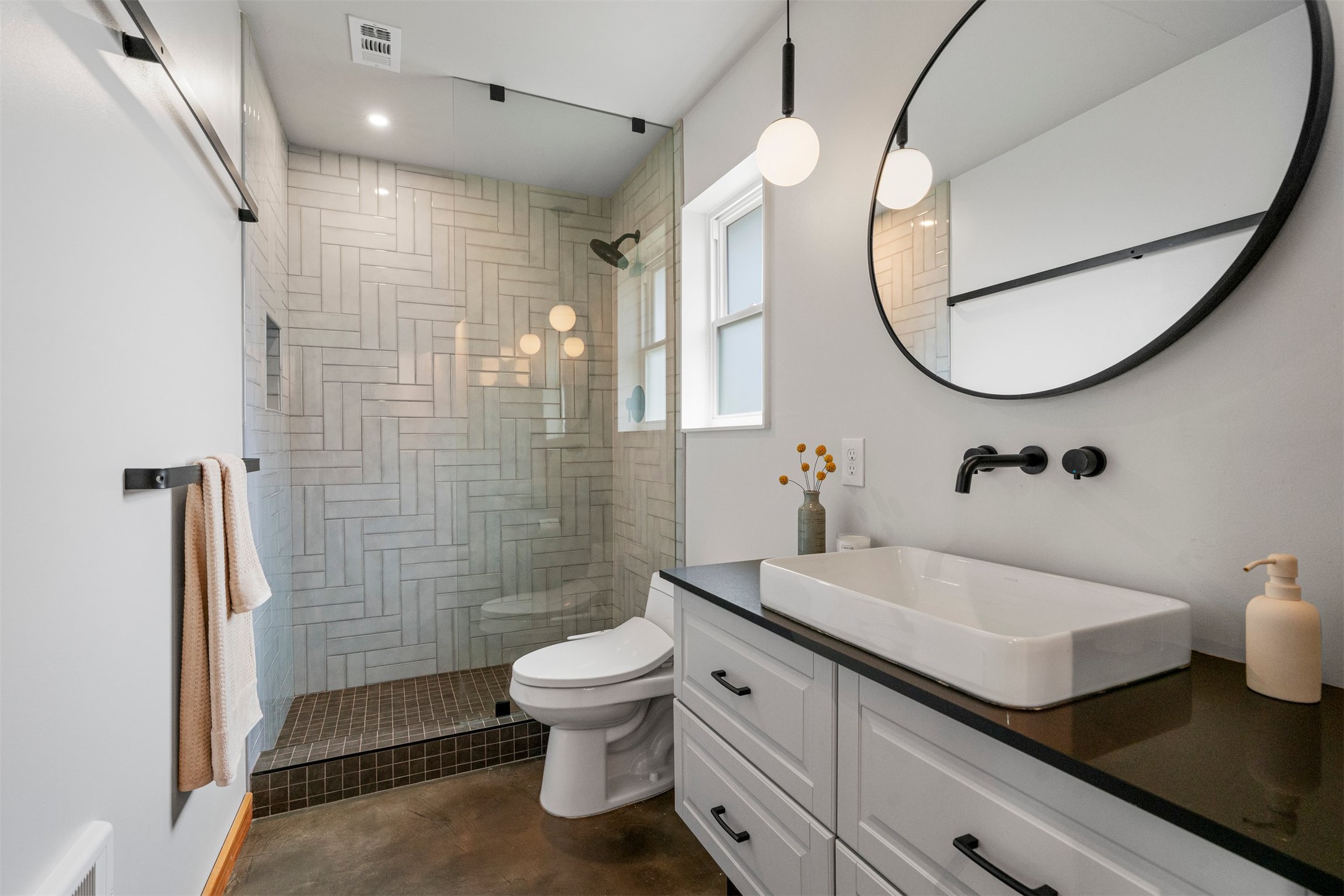 1111 Radam Circle Austin, TX 78745 - Photo 28 of 40 The remodeled primary bathroom features modern finishes and an updated layout that supports everyday routines with a clean, refreshed look