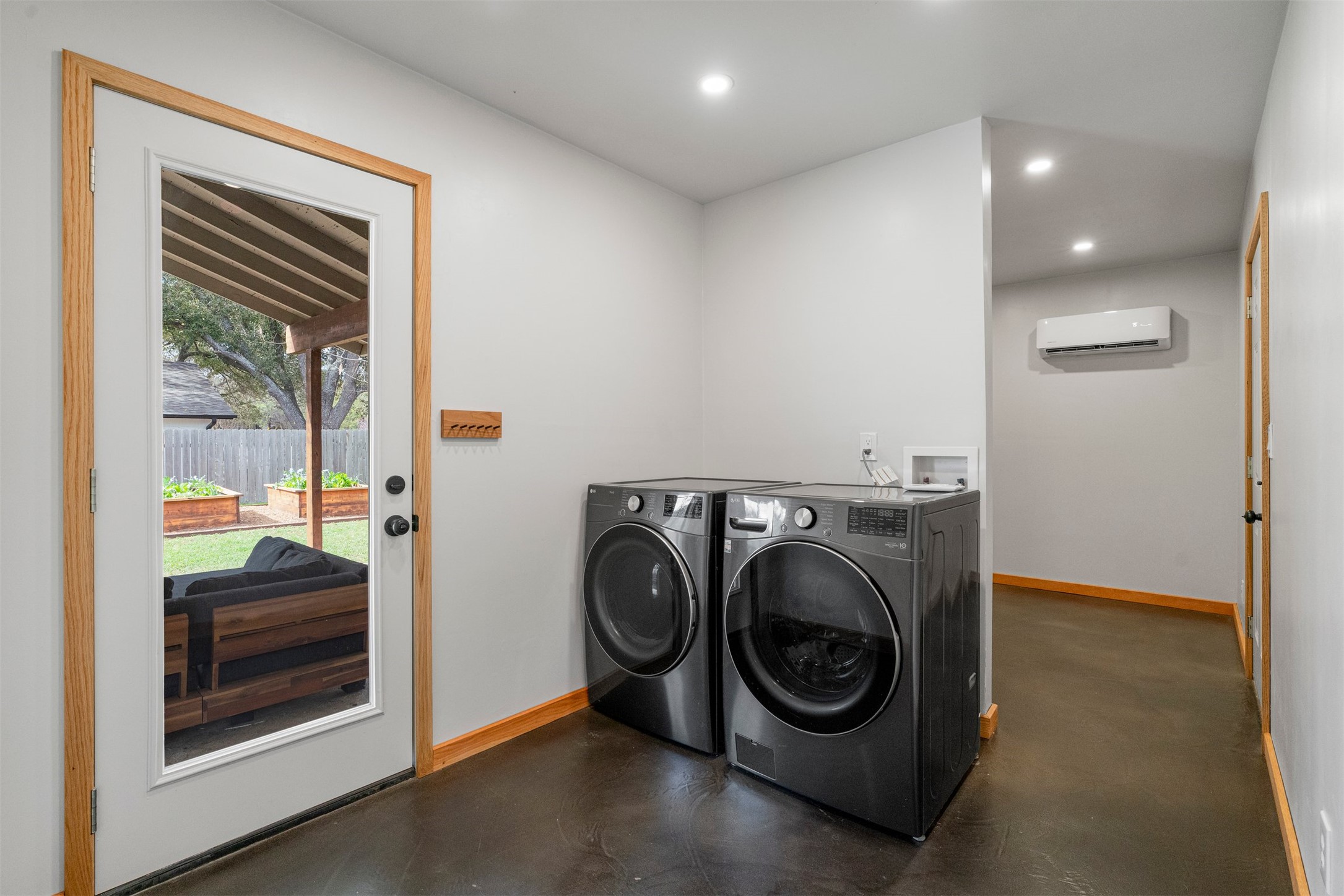 1111 Radam Circle Austin, TX 78745 - Photo 32 of 40 The laundry area provides a practical spot for daily routines, with space for full-size appliances and nearby storage that helps keep cleaning supplies and linens neatly tucked away