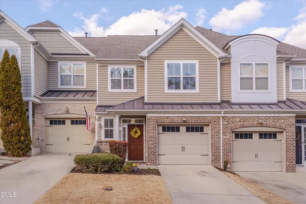 a front view of a house with a garage