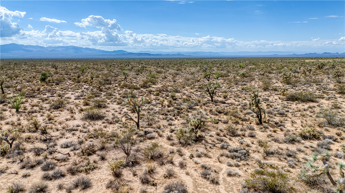 19595 South Kit Carson Road Yucca, AZ 86438 - Photo 8 of 18 View of mountain background featuring a desert landscape and rural landscape
