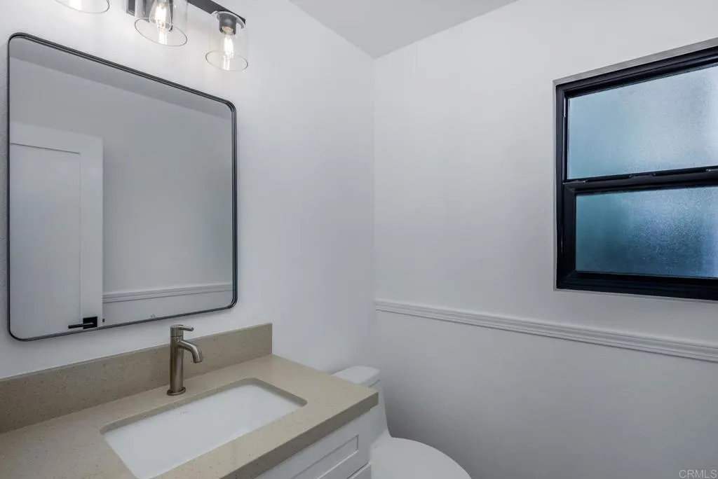 250 Hillcrest Drive Encinitas, CA 92024 - Photo 22 of 54 a bathroom with a sink and a mirror
