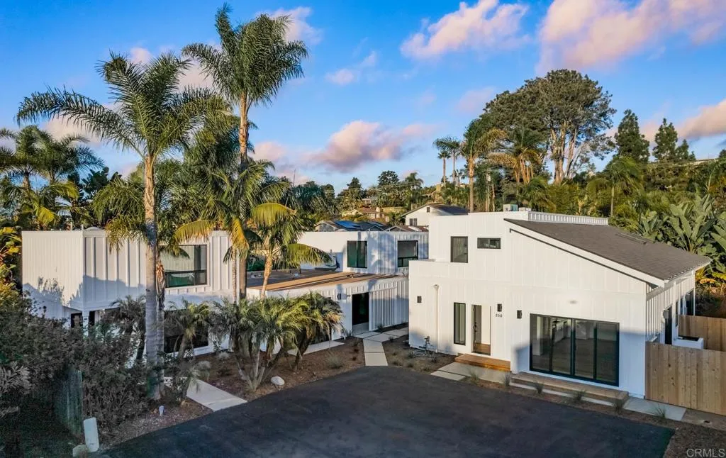250 Hillcrest Drive Encinitas, CA 92024 - Photo 2 of 54 a view of a white house with a yard