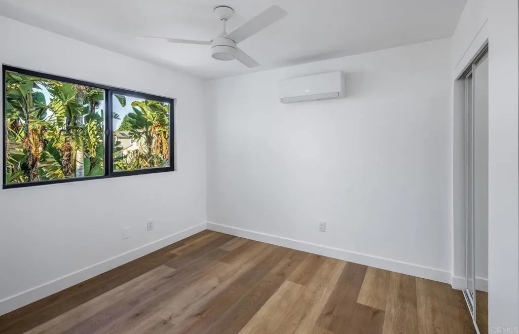 250 Hillcrest Drive Encinitas, CA 92024 - Photo 25 of 54 wooden floor in an empty room with a window