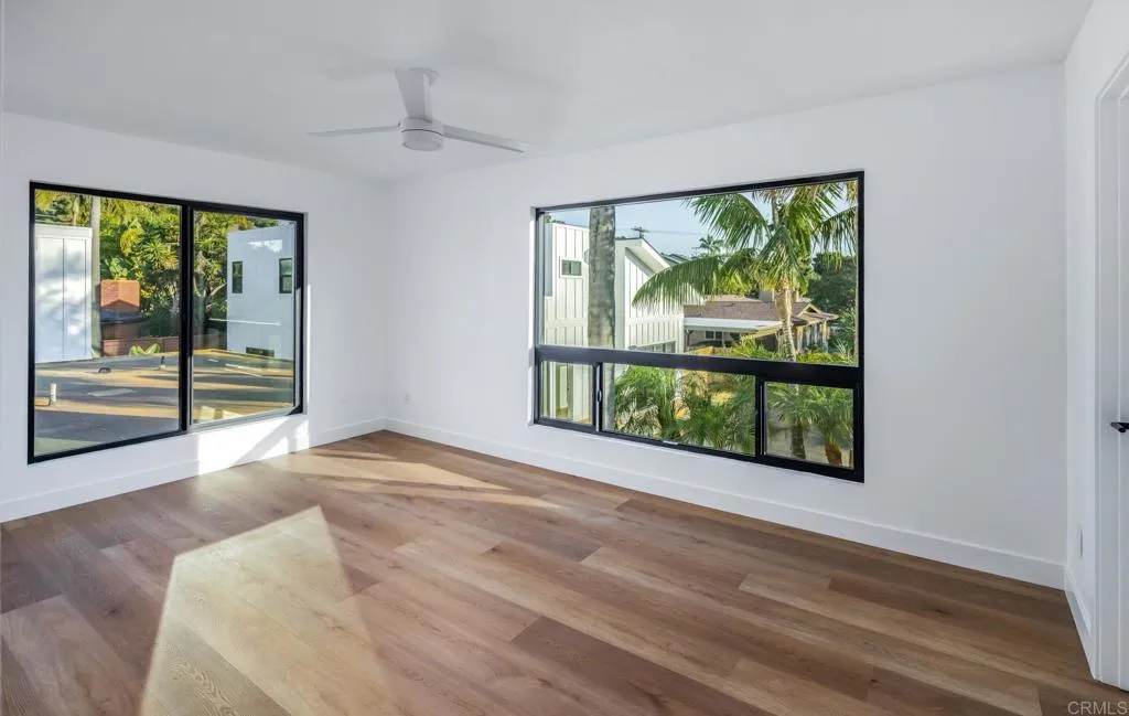 250 Hillcrest Drive Encinitas, CA 92024 - Photo 27 of 54 a view of an empty room with wooden floor and a window