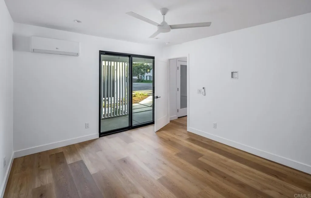 250 Hillcrest Drive Encinitas, CA 92024 - Photo 39 of 54 wooden floor in an empty room with a window
