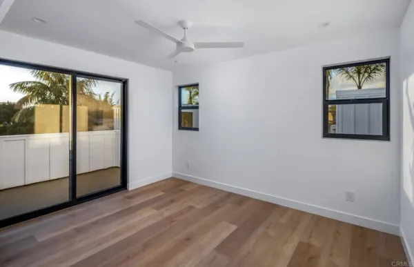 a kitchen with stainless steel appliances granite countertop a sink a stove a refrigerator and cabinets with wooden floor