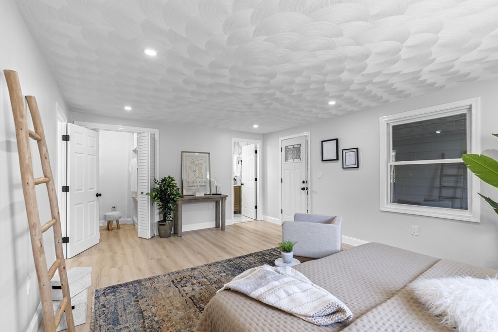 181 Green Street Stoneham, MA 02180 - Photo 14 of 42 a living room with furniture and a wooden floor