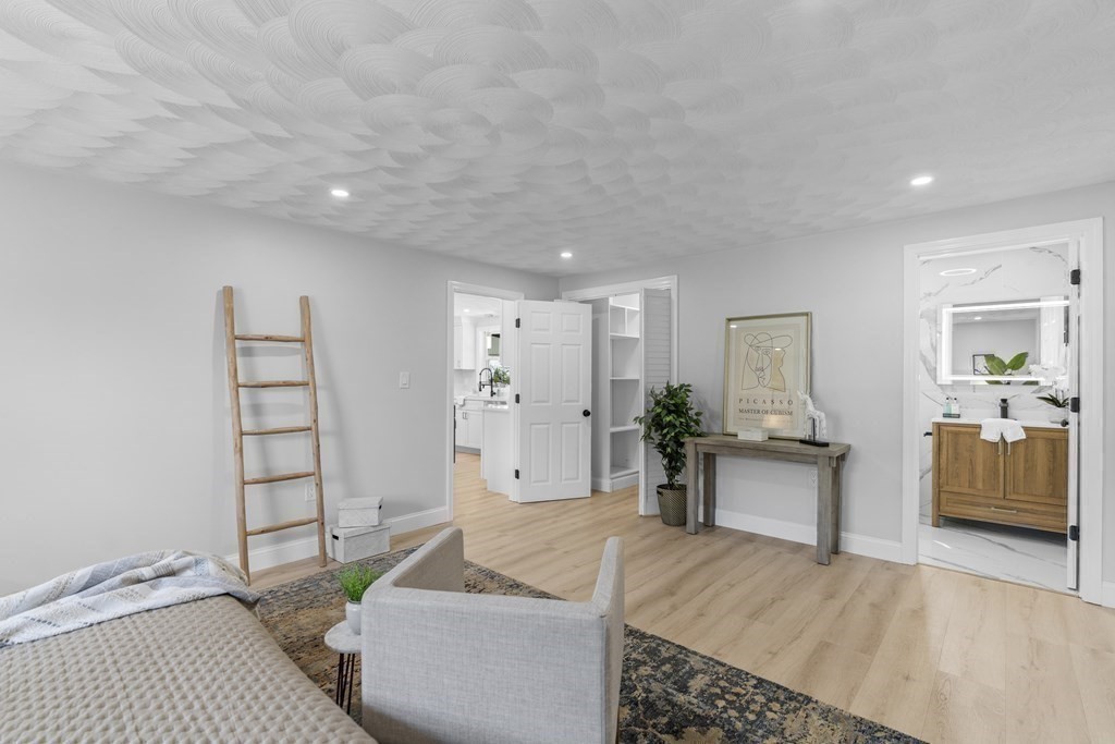181 Green Street Stoneham, MA 02180 - Photo 16 of 42 a spacious bedroom with a bed and furniture