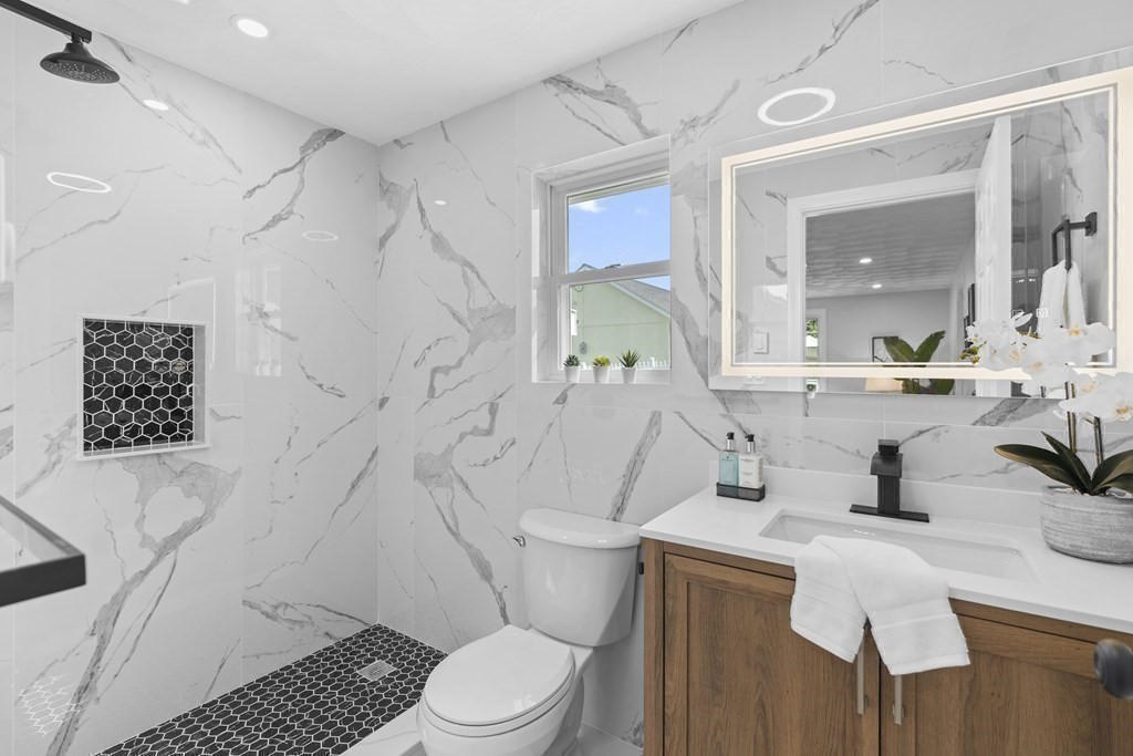 181 Green Street Stoneham, MA 02180 - Photo 17 of 42 a bathroom with a sink toilet and shower