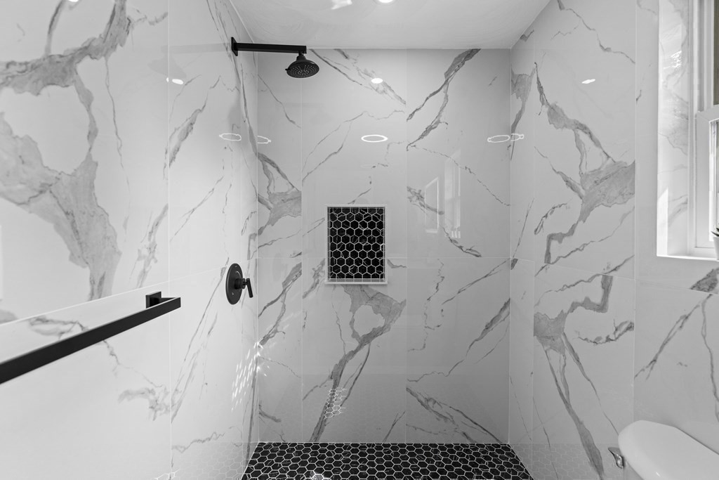 181 Green Street Stoneham, MA 02180 - Photo 18 of 42 a bathroom with a sink a toilet and shower