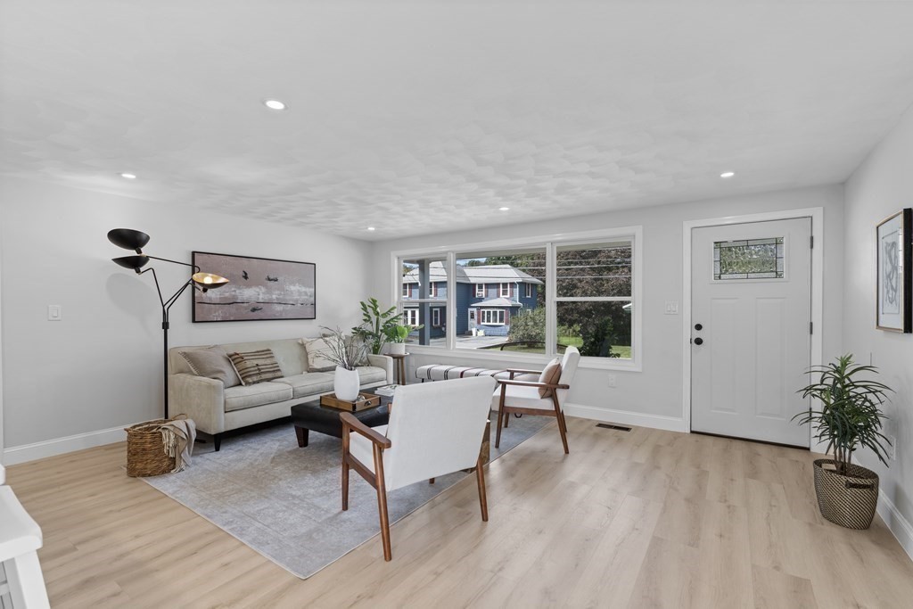 181 Green Street Stoneham, MA 02180 - Photo 3 of 42 a living room with furniture and a potted plant