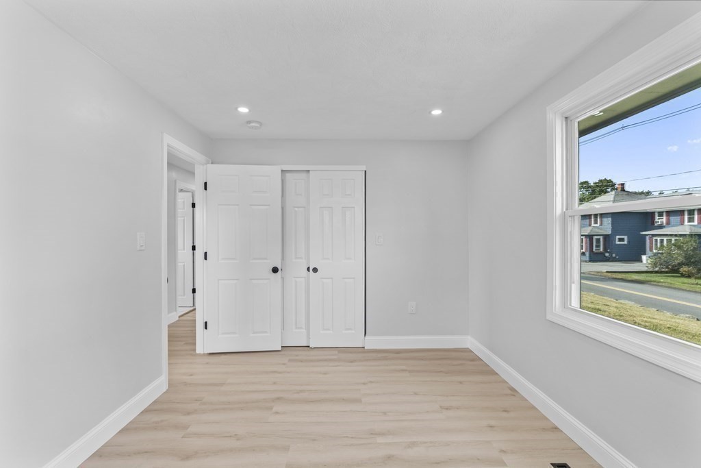 181 Green Street Stoneham, MA 02180 - Photo 31 of 42 a view of a room with wooden floor and cabinet