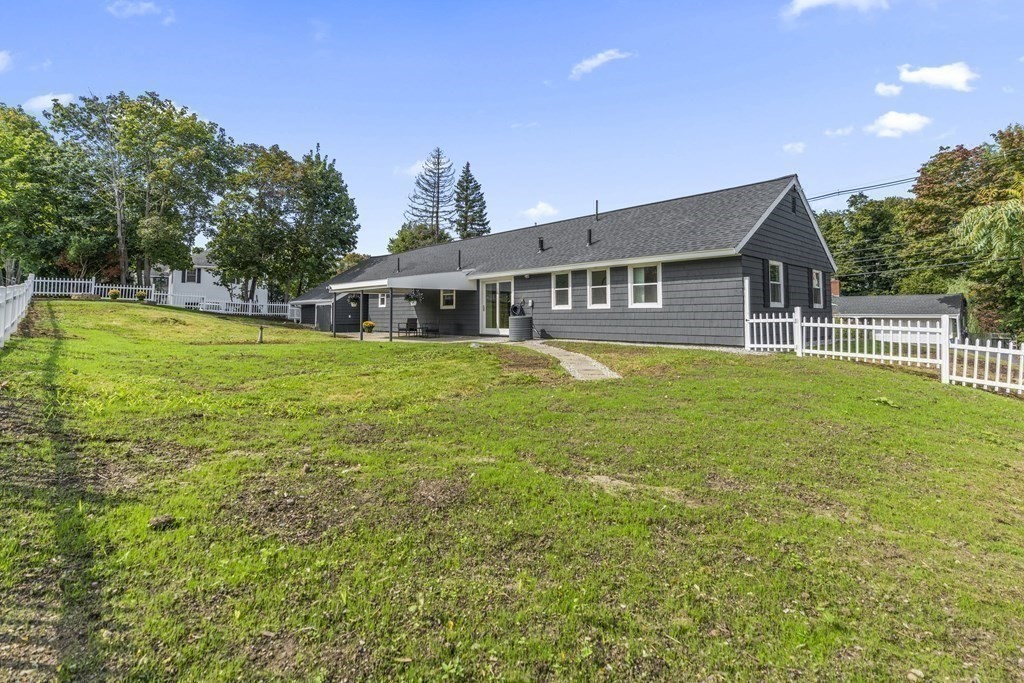 181 Green Street Stoneham, MA 02180 - Photo 35 of 42 a house view with a sitting space and garden