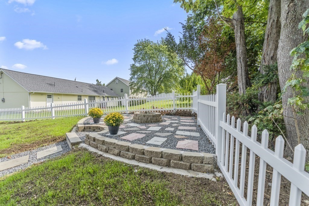 181 Green Street Stoneham, MA 02180 - Photo 36 of 42 a view of a swimming pool with a patio and a yard