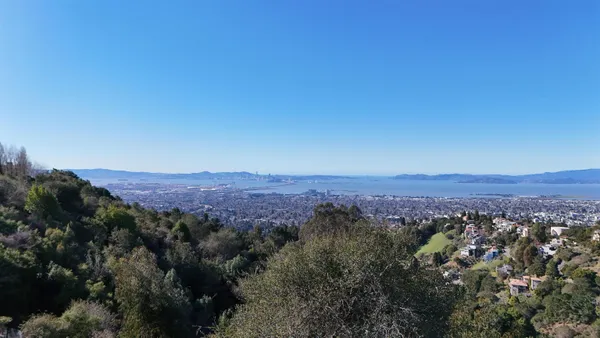 an aerial view of residential house and green space