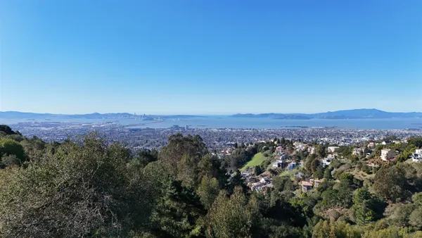 an aerial view of residential house and green space