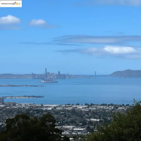 a view of an ocean beach and mountain