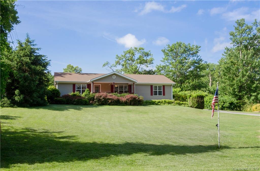 452 Souther Road Fletcher, NC 28732 - Photo 2 of 24 a front view of a house with a garden