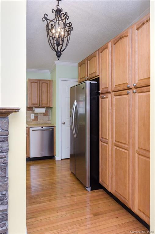 452 Souther Road Fletcher, NC 28732 - Photo 12 of 24 a kitchen with stainless steel appliances granite countertop a refrigerator and a sink
