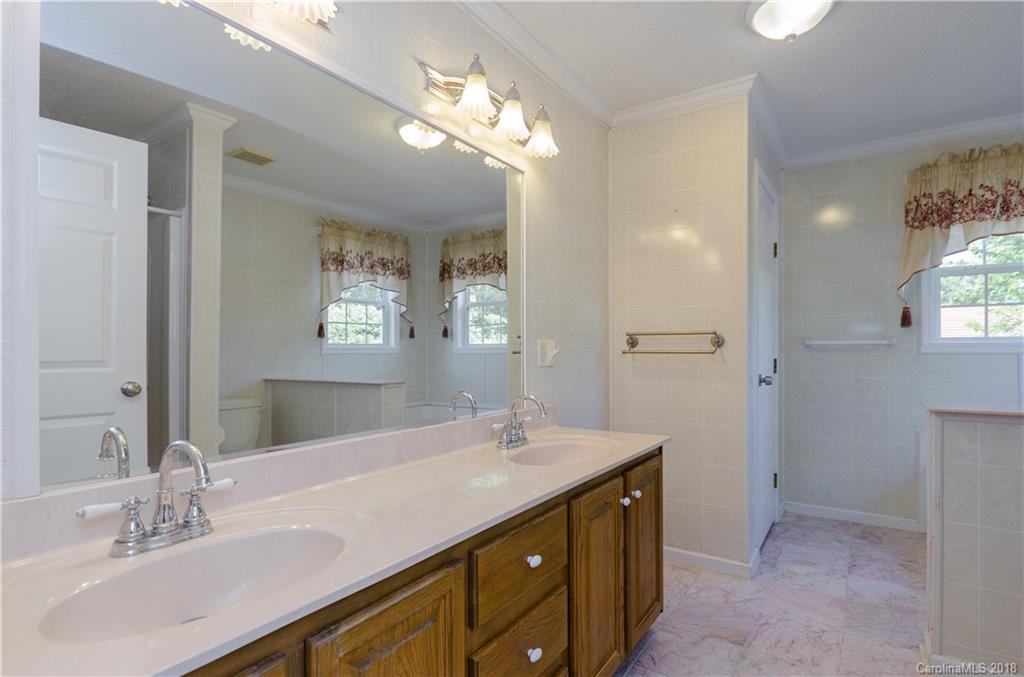 452 Souther Road Fletcher, NC 28732 - Photo 15 of 24 a bathroom with a sink double vanity and a mirror