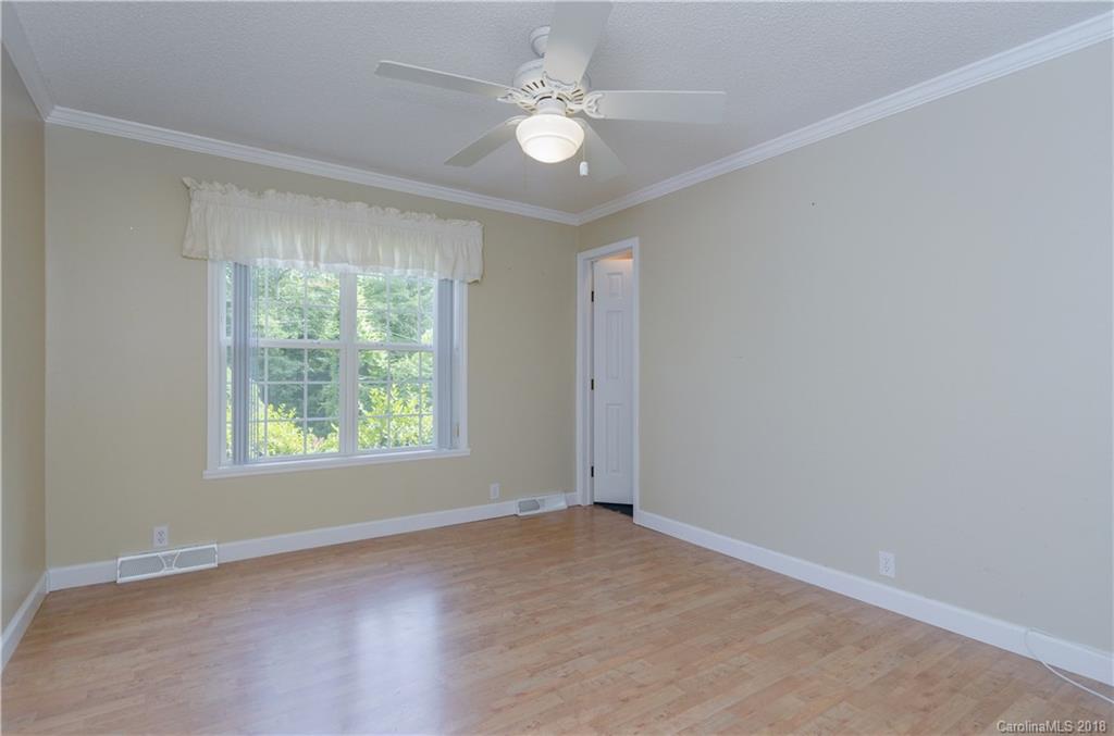 452 Souther Road Fletcher, NC 28732 - Photo 17 of 24 an empty room with windows and ceiling fan