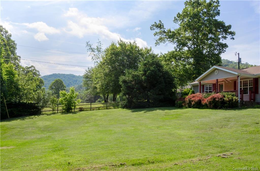 452 Souther Road Fletcher, NC 28732 - Photo 3 of 24 a front view of a house with yard and green space
