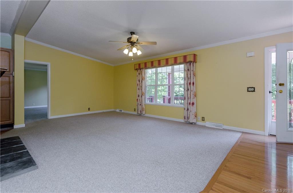 452 Souther Road Fletcher, NC 28732 - Photo 6 of 24 wooden floor in an empty room with a window