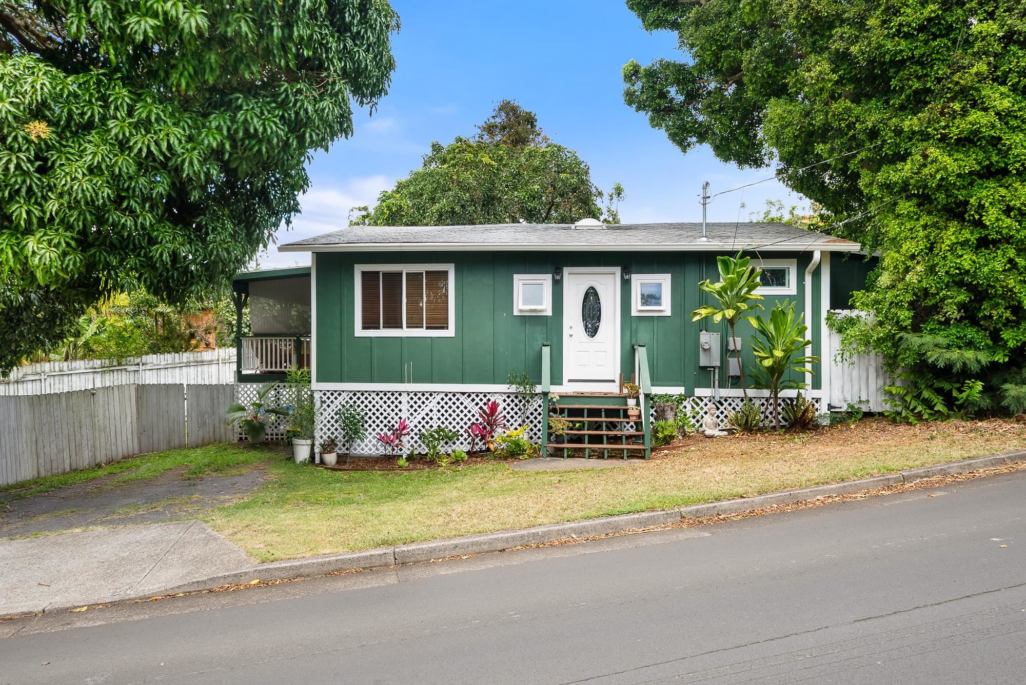 323 West Kuiaha Road Haiku, HI 96708 - Photo 12 of 30 a view of a house with a yard plants and large tree