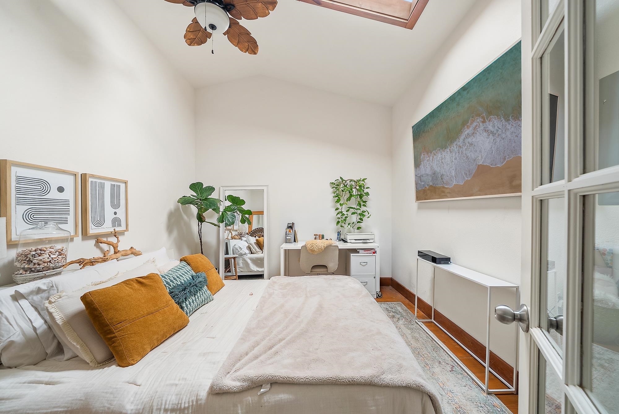 323 West Kuiaha Road Haiku, HI 96708 - Photo 23 of 30 a bedroom with furniture and a painting on the wall