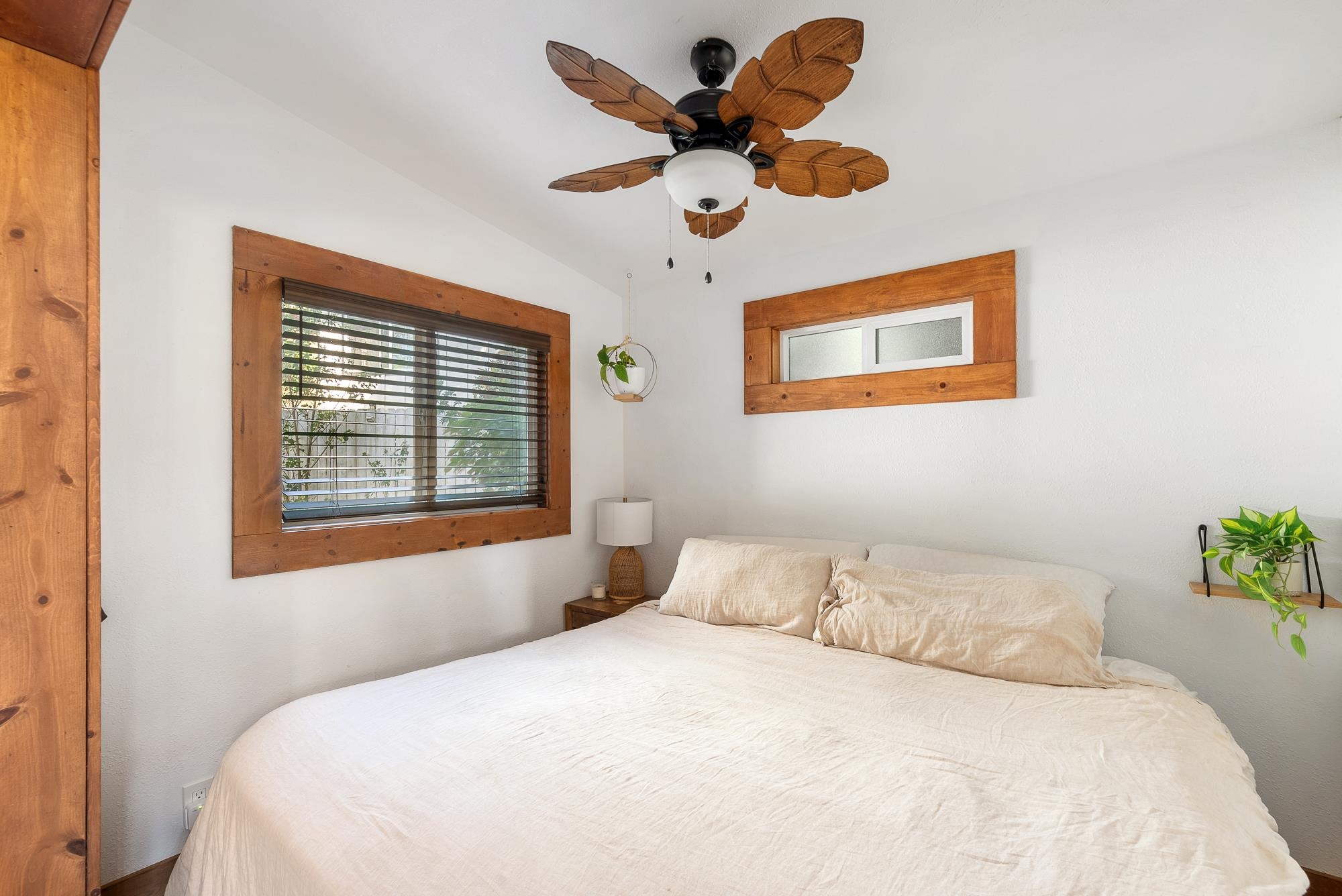 323 West Kuiaha Road Haiku, HI 96708 - Photo 24 of 30 a bedroom with a bed and a large window