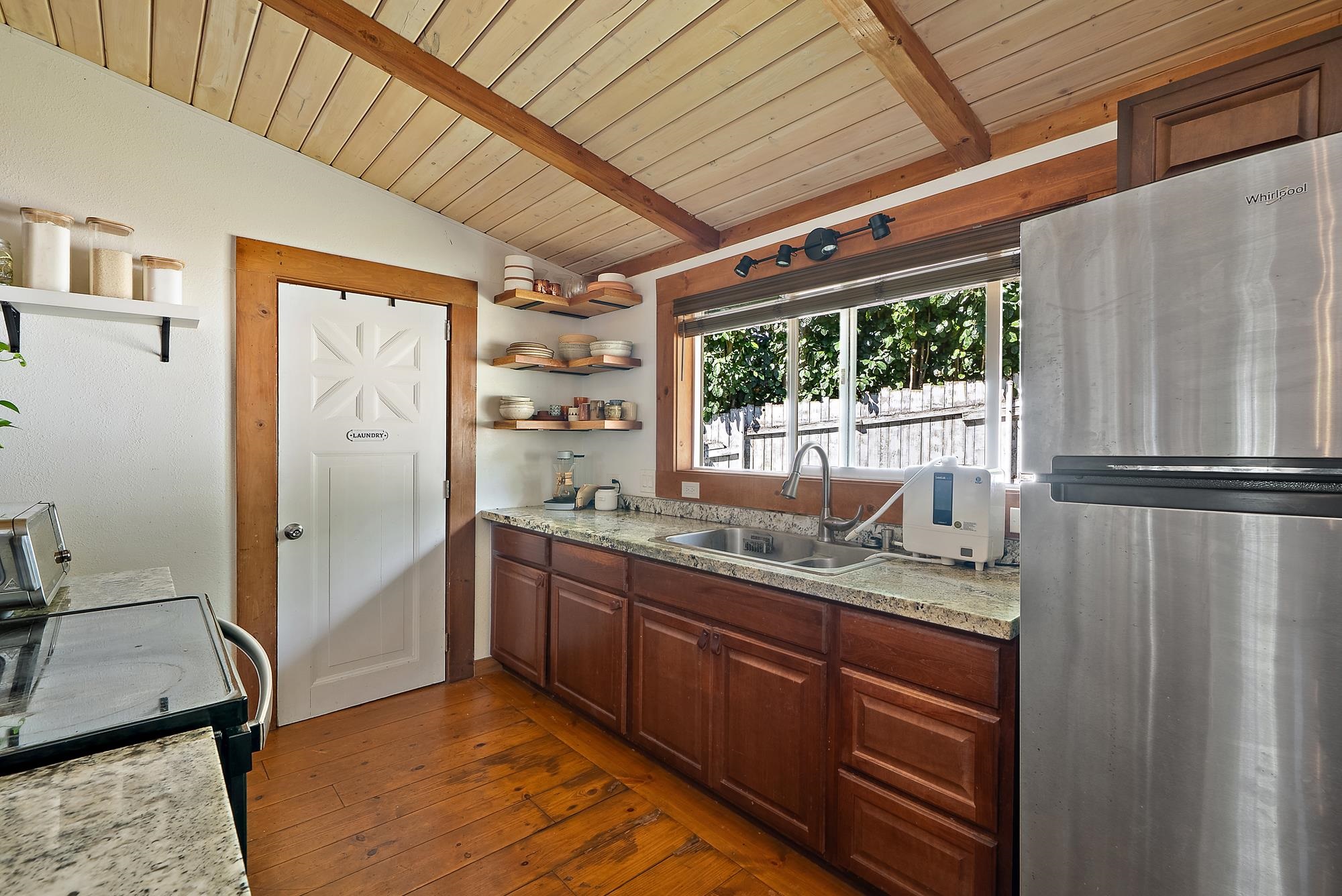 323 West Kuiaha Road Haiku, HI 96708 - Photo 8 of 30 a kitchen with stainless steel appliances granite countertop a refrigerator and a sink