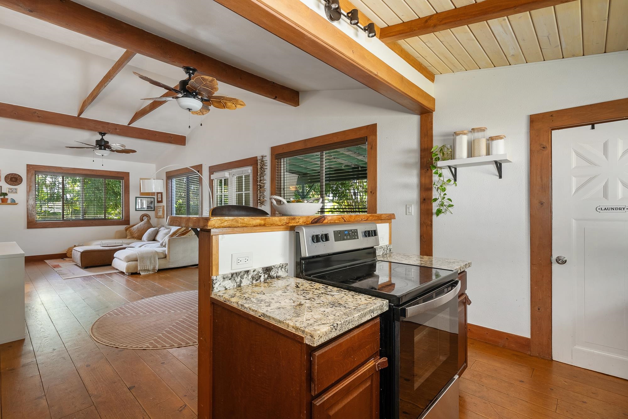 323 West Kuiaha Road Haiku, HI 96708 - Photo 9 of 30 a living room with furniture and a flat screen tv