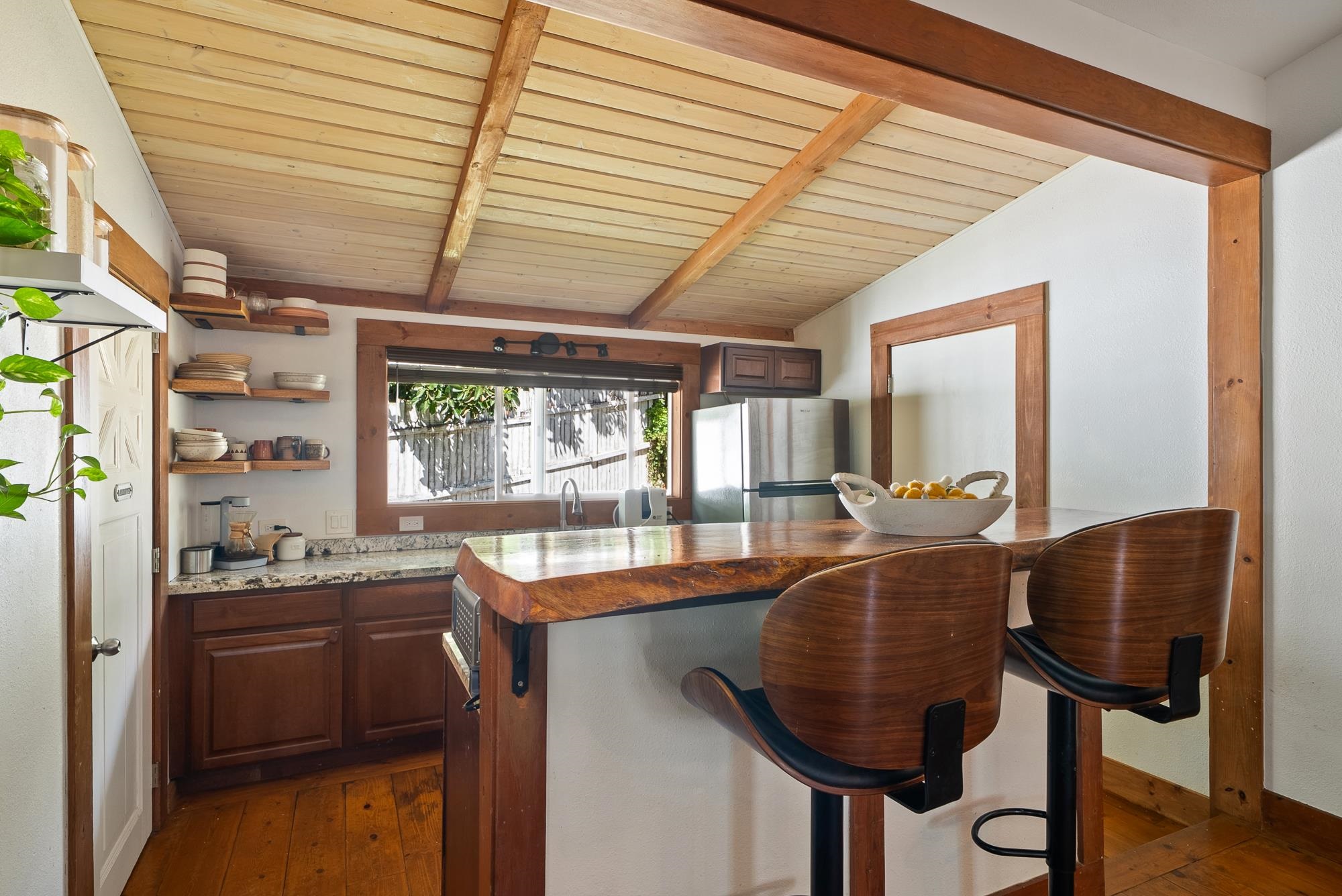 323 West Kuiaha Road Haiku, HI 96708 - Photo 10 of 30 a kitchen with stainless steel appliances granite countertop a sink a stove and a refrigerator