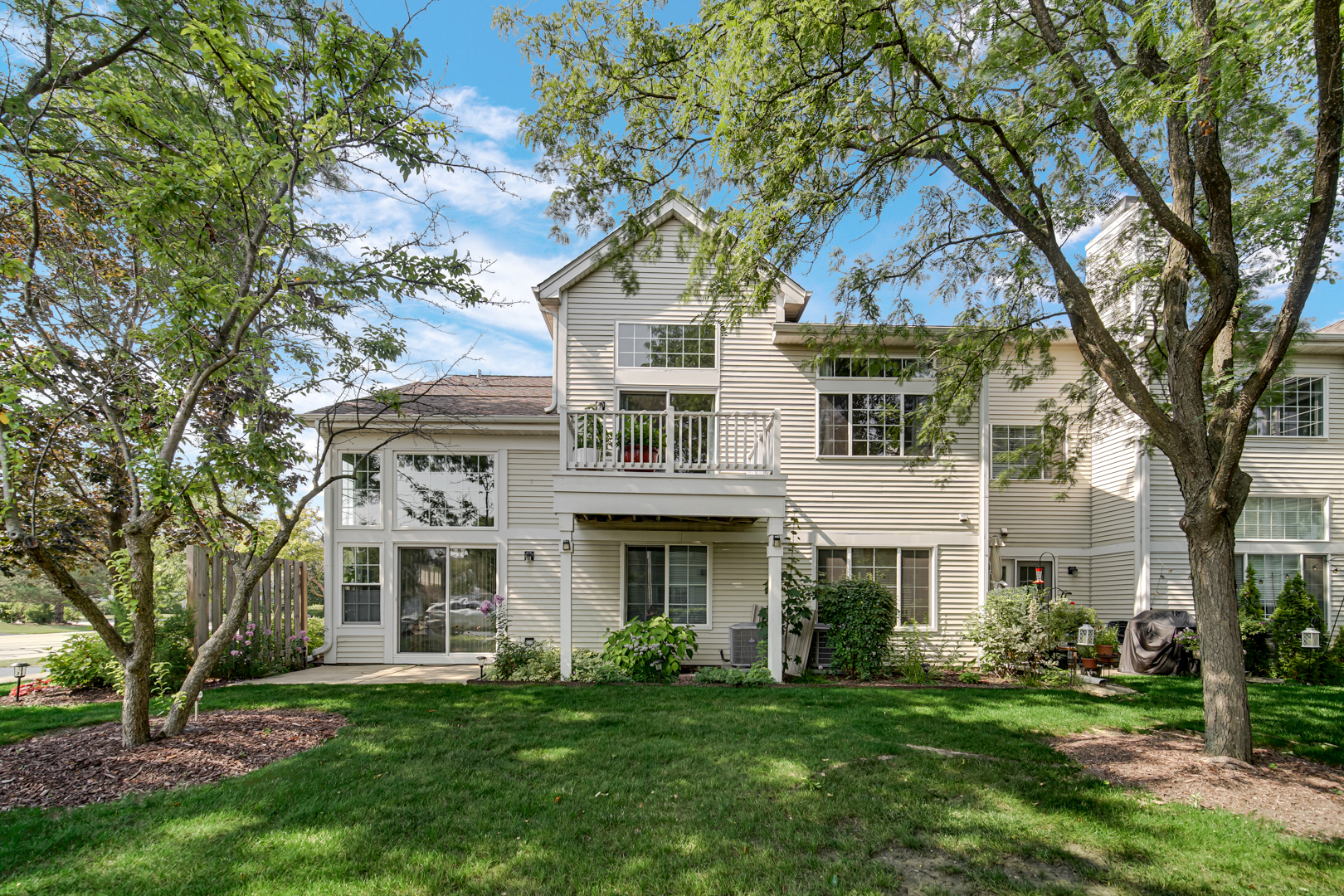 1164 Bristol Lane, Unit 1164 Buffalo Grove, IL 60089 - Photo 2 of 2 front view of a house with a garden