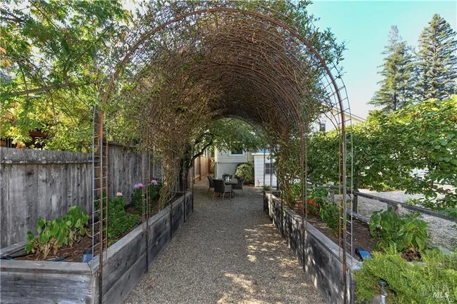 a large house with a large parking space and a yard