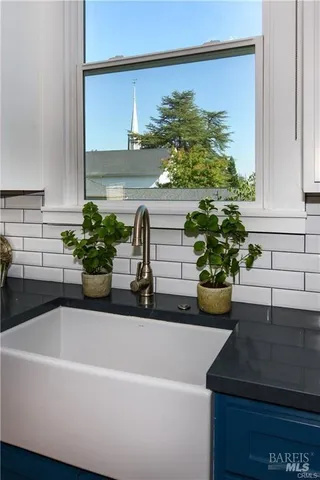 a white bath tub sitting next to a white sink