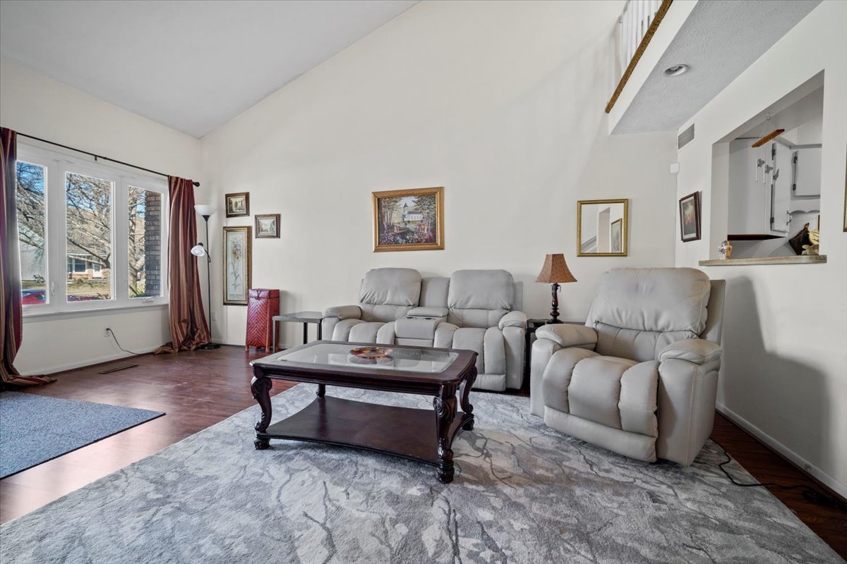 1702 Rockingham Drive, Unit 5 Normal, IL 61761 - Photo 4 of 17 a living room with furniture and a potted plant