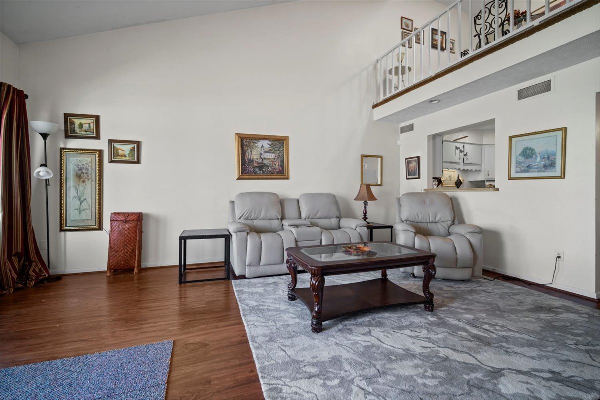 1702 Rockingham Drive, Unit 5 Normal, IL 61761 - Photo 5 of 17 a living room with furniture and wooden floor
