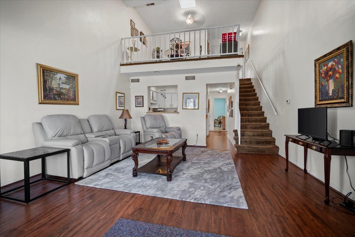 1702 Rockingham Drive, Unit 5 Normal, IL 61761 - Photo 6 of 17 a living room with furniture and a flat screen tv