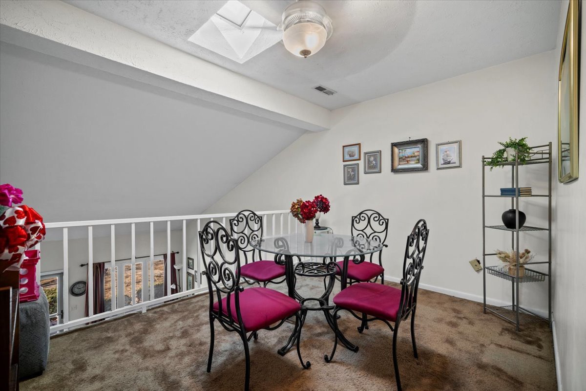 1702 Rockingham Drive, Unit 5 Normal, IL 61761 - Photo 8 of 17 a view of a dining room with furniture and wooden floor