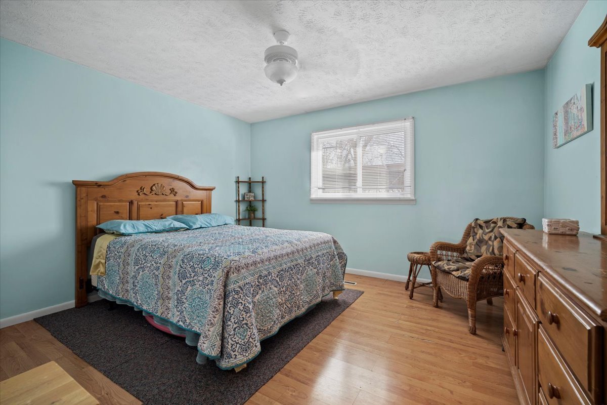 1702 Rockingham Drive, Unit 5 Normal, IL 61761 - Photo 9 of 17 a bedroom with bed and window