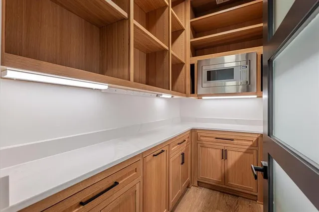 a view of a storage and utility room with a sink