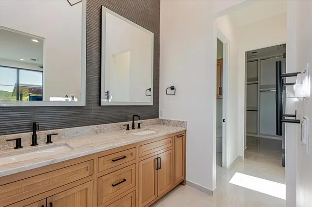a bathroom with a granite countertop shower