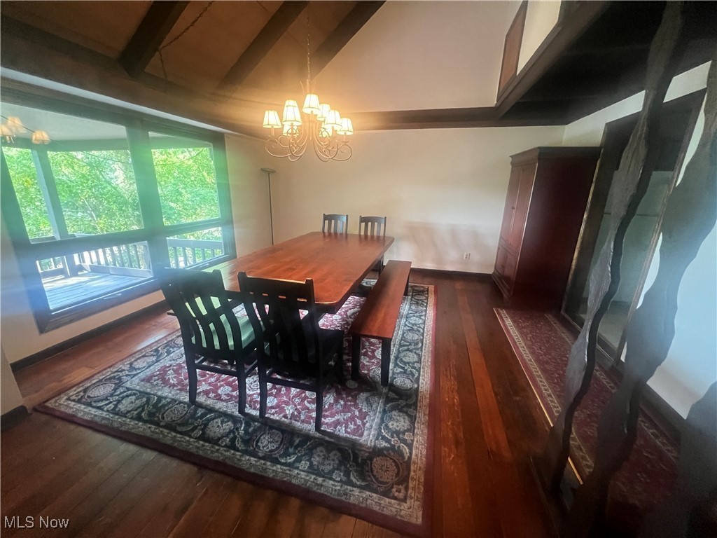 86301 North Bay Road Scio, OH 43988 - Photo 6 of 50 Dining space with vaulted ceiling with beams, dark wood-type flooring, and a notable chandelier