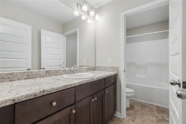 a backyard of a house with large trees