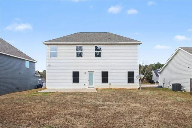 a house view with a backyard space